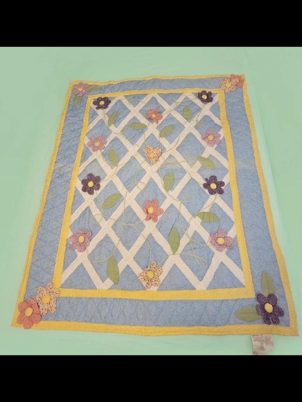 Handmade Blue Floral Appliqué Quilt with Yellow Trim